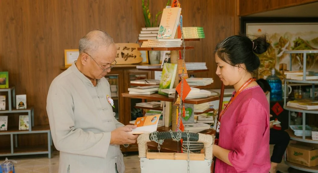 Community members browsing and selecting seed packets from a library display