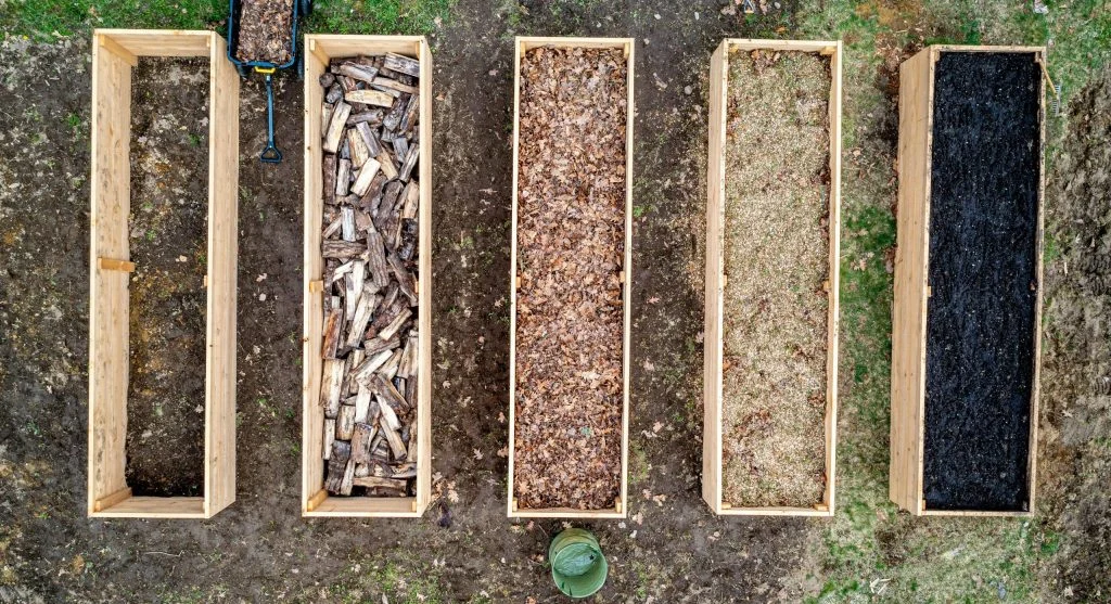 Garden beds covered with fall mulch, tools cleaned and stored for winter